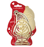 Emporte pièce en inox avec son tampon en bois de la même forme avec des motifs. Ils ont l aforme d'un père Noël. L'ensemble est disposé dans son emballage de la marque scrapCooking