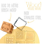 Tampon en bois en forme de dés en bois avec son découpoir en inox. Il est présenté dans son emballage. Le tampon représente des motifs de chat