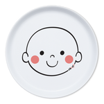 Assiette en porcelaine blanche avec une illustration de tête de bonhomme rigolos au centre. Elle est de la marque Cibolo , indiqué sur l’oval du visage. L’assiette permet de créer des repas rigolos en animant le personnage 