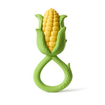 Jouet de dentition de la marque Oli&Carol. Le hochet represente un épi de maïs, il a un anneau de prise en main vert et la tête du hochet représente un épi de maïs avec ses feuilles