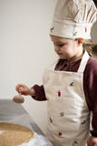 Ensemble de tablier et toque pour enfant en coton avec des illustrations brodées sur le theme de Noël