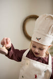 Ensemble de tablier et toque pour enfant en coton avec des illustrations brodées sur le theme de Noël