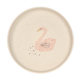 Assiette pour enfant de couleur beige avec une jolie illustration de cygne rose sur le milieu. L'assiette est sur un fond blanc