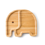 Assiette en bambou en forme d'elephant pour enfant. L'assiette est posée sur un fond blanc, elle a 2 compartiments. Le corp et la tête avec un oeil de dessiné dessus.