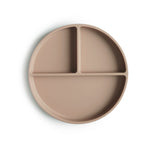 Assiette en silicone compartimentée sur un fond blanc et de couleur beige