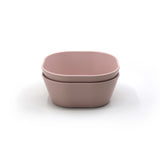 Photo sur fond blanc de bol aux formes carrés et de couleurs rose