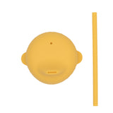 Couvercle en silicone de couleur jaune avec posé a coté une paille de la même couleur