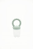 Grignoteuse pour enfant en silicone avec un anneau qui a des formes de boules de couleur vert d'eau