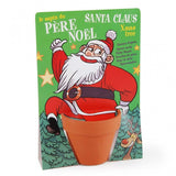 Kit de jardinage pour enfant, pour planter un spain de noël. Le kit est représenté avec une carte de père Noël.  