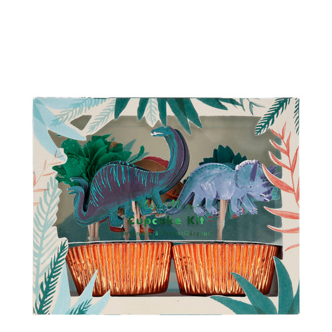 Photo kit à cupcake de la marque meri meri , sur le theme des dinosaure avec des piques decoratves en forme de dinosaure et des caissettes a gateau couleur cuivre brillant