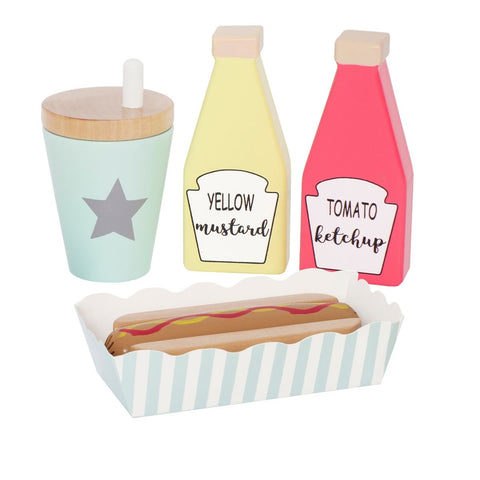 Jouet pour enfant en bois composé de 4 élements representant un kit a hot dog avec une gobelet avec paille, 2 bouteilles de sauche ketchup et moutard ainsi qu'une barquette contenant un hot dog