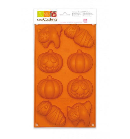 Emballage de moule en silicone de la marque scrapcookinG. Le moule est de couleur orange, il est composé de 8 petits alvéoles sur le thème d'halloween. Il y a des citrouilles, citrouilles décorées, momies et chat