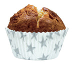 Muffin dans un moule de couleur blanc avec des motifs étoiles argentées