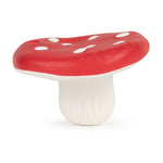 Jouet pour enfant en forme de champignon rouge et blanc posé sur un fond blanc